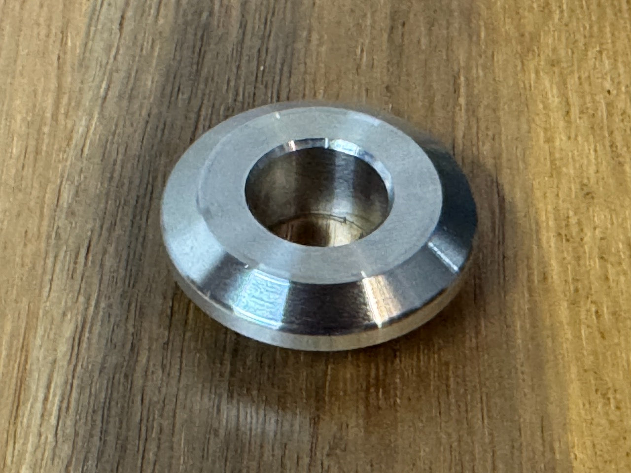 EXTSW  .634” ID x 1.490" OD x 1/2” thick -Stepped 1/4 x 1" - Beveled 316 Stainless Washers