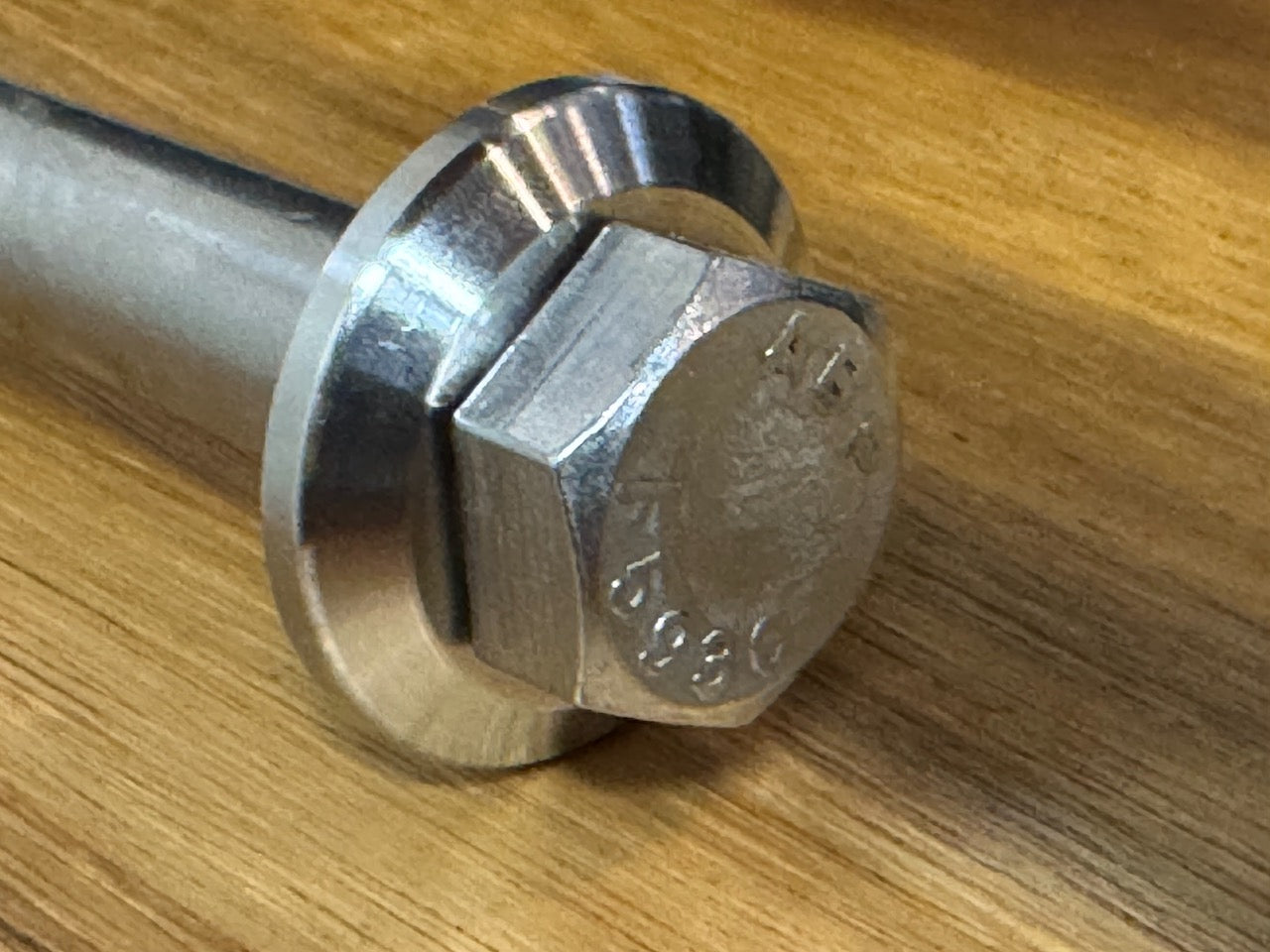 EXTSW  .634” ID x 1.490" OD x 1/2” thick -Stepped 1/4 x 1" - Beveled 316 Stainless Washers