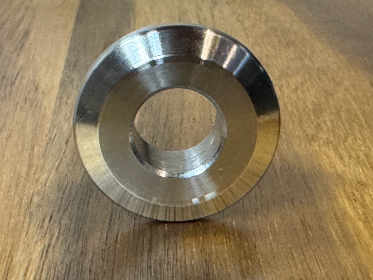 EXTSW  .634” ID x 1.490" OD x 1/2” thick -Stepped 1/4 x 1" - Beveled 316 Stainless Washers