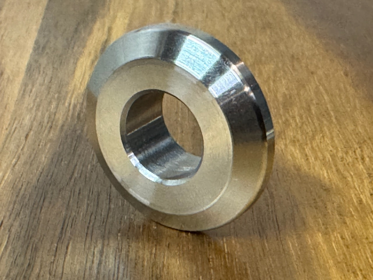 EXTSW  .634” ID x 1.490" OD x 1/2” thick -Stepped 1/4 x 1" - Beveled 316 Stainless Washers